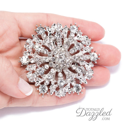 antique rhinestone wedding brooch in hand