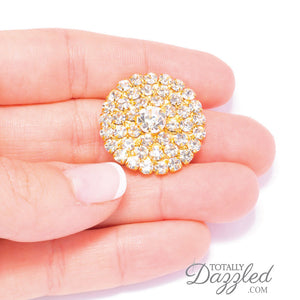 Gold Rhinestone Invitation Embellishments in Hand