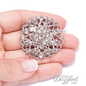 silver rhinestone flower brooch In Hand